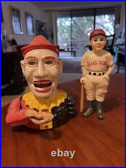 2 Vintage Cast Iron Banks. One is a Clown and the other looks like Babe Ruth
