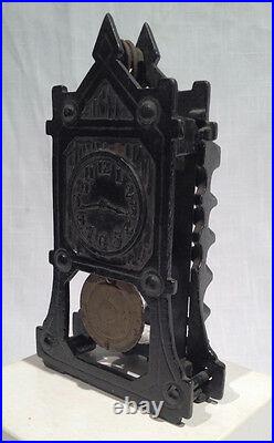 ARCADE IRON CLOCK STILL BANK with MOVABLE PENDULUM, C. 1923, ALL ORIGINAL