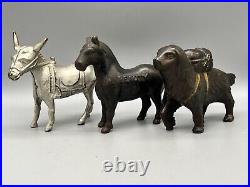 A Group Of Cast Iron Animal Banks