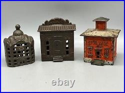 A Group Of Cast Iron Building Banks