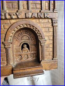 Antique 1890s Cast Iron City Bank with Teller by Judd Original Brass Finish