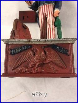 Antique Cast Iron Uncle Sam Mechanical Bank by Shepard Hardware cir. June 8, 1886