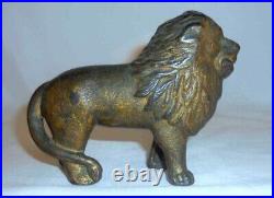 Antique Gold Colored Cast Iron Still Penny Bank Standing Lion With Tail Right