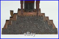 Antique J&E Stevens Magician Mechanical Cast Iron Bank