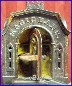 Antique MECHANICAL MAGIC BANKCast Iron Pat. Mar 7 1876Authentic & working