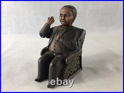 Antique Man Sitting In A Chair Mechanical Bank