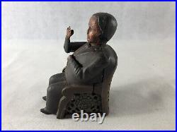 Antique Man Sitting In A Chair Mechanical Bank