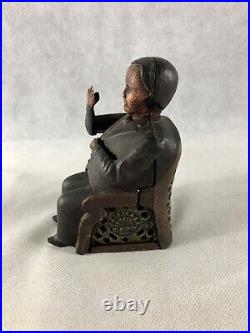 Antique Man Sitting In A Chair Mechanical Bank