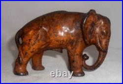 Antique Painted Cast Iron Still Penny Bank Elephant with Tucked Trunk by Arcade US Antique Painted Cast Iron Still Penny Bank Elephant with Tucked Trunk by Arcade US
