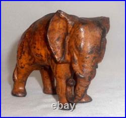 Antique Painted Cast Iron Still Penny Bank Elephant with Tucked Trunk by Arcade US Antique Painted Cast Iron Still Penny Bank Elephant with Tucked Trunk by Arcade US