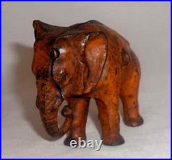 Antique Painted Cast Iron Still Penny Bank Elephant with Tucked Trunk by Arcade US Antique Painted Cast Iron Still Penny Bank Elephant with Tucked Trunk by Arcade US