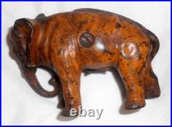 Antique Painted Cast Iron Still Penny Bank Elephant with Tucked Trunk by Arcade US Antique Painted Cast Iron Still Penny Bank Elephant with Tucked Trunk by Arcade US