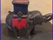 Antique cast iron mechanical elephant bank man pops out 1800s