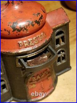 Antique cast iron mechanical presto bank