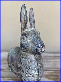Antique cast iron standing Rabbit Bank. Some indications of white paint