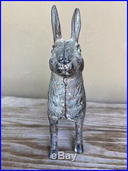 Antique cast iron standing Rabbit Bank. Some indications of white paint