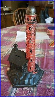 Antique vintage cast iron bank lighthouse