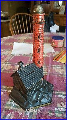 Antique vintage cast iron bank lighthouse