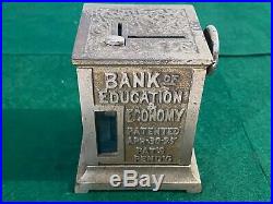 C. 1895 Bank of Education & Economy Cast Iron Mechanical Bank Toy with Paper Roll