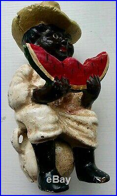 Cast Iron Piggy Bank of a Young Black Boy Eating Watermelon