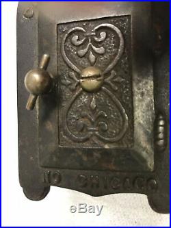 Chicago J. M. Harper Stork with Baby Cast Iron Bank circa 1907 in good condition