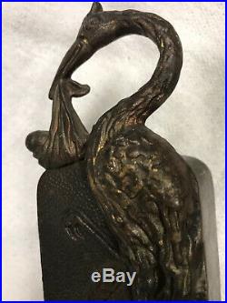 Chicago J. M. Harper Stork with Baby Cast Iron Bank circa 1907 in good condition