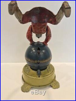 Clown On Globe Cast Iron Mechanical Bank J&E Stevens