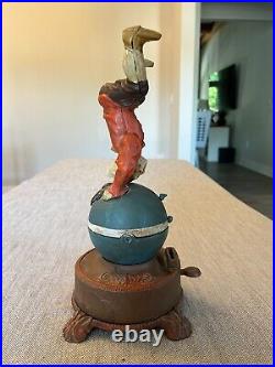 Clown on Globe Cast Iron Mechanical Bank