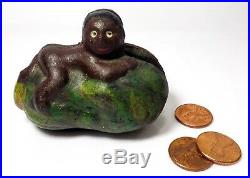 Early 20th C Black Americana Painted Cast Iron Bank Of Boy Straddling Watermelon