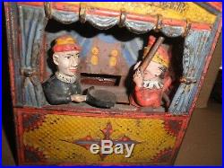 Great old original cast iron Punch and Judy Mechanical Penny Bank c. 1884 1906