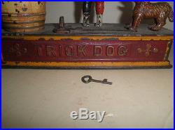 Great old original cast iron Trick Dog mechanical penny bank with key pat. 1888