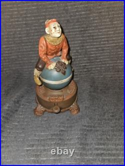 J & E Stevens Clown on Globe Cast Iron Mechanical Coin Bank Spinning Acrobat
