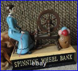 Mechanical Spinning Wheel Bank, cast iron, C. Hawthorne Direct LLC