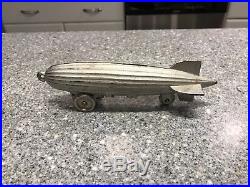 Mint Condition Circa 1934 Cast Iron Graf Zeppelin on Wheels Pull Toy Bank