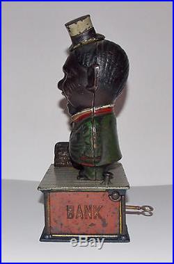 ORIGINAL ANTIQUE BLACK AMERICANA CAST IRONSTUMP SPEAKERMECHANICAL BANK C1886