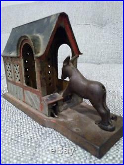 Original cast iron mechanical bank, circa=1880 donkey barn dog