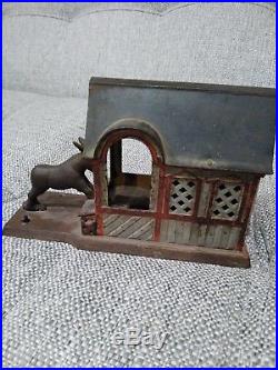 Original cast iron mechanical bank, circa=1880 donkey barn dog