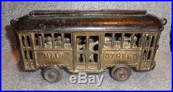 Rare old painted cast iron street car trolley toy still bank