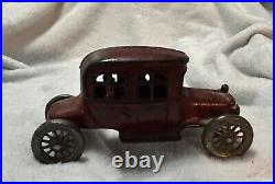 Vintage Cast Iron Still Bank Car With People And Rolling Wheels