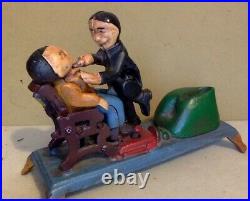 Vintage Cast Iron Toy Mechanical Bank. Dentist Pulling A Tooth