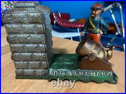 Vintage Earlier Artillery Book of Knowledge Cast Iron Mechanical Coin Bank
