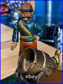 Vintage Earlier Artillery Book of Knowledge Cast Iron Mechanical Coin Bank