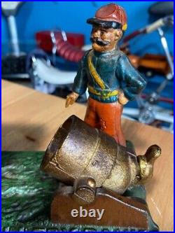 Vintage Earlier Artillery Book of Knowledge Cast Iron Mechanical Coin Bank