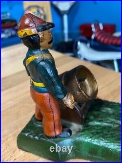 Vintage Earlier Artillery Book of Knowledge Cast Iron Mechanical Coin Bank