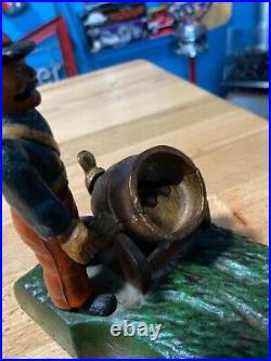 Vintage Earlier Artillery Book of Knowledge Cast Iron Mechanical Coin Bank