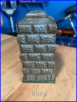 Vintage Earlier Artillery Book of Knowledge Cast Iron Mechanical Coin Bank