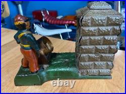 Vintage Earlier Artillery Book of Knowledge Cast Iron Mechanical Coin Bank