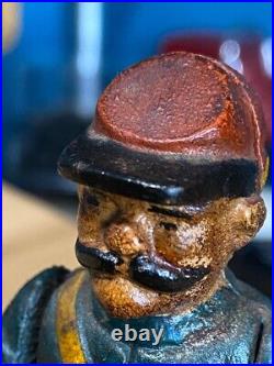 Vintage Earlier Artillery Book of Knowledge Cast Iron Mechanical Coin Bank
