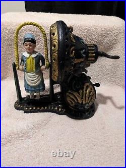 Works! Cast Iron Mechanical Bank Girl Skipping Rope